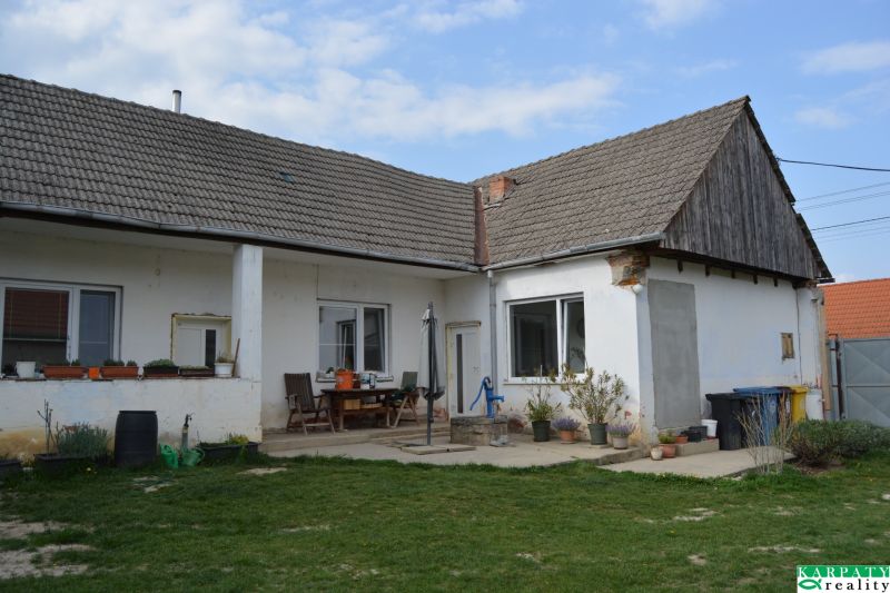A family house in Nižná with a lawn, terrace, and garden furniture.