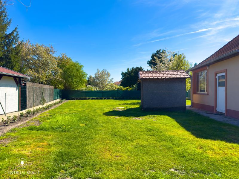 A garden at a family house in Orechová Potôň with a lawn and a gazebo.