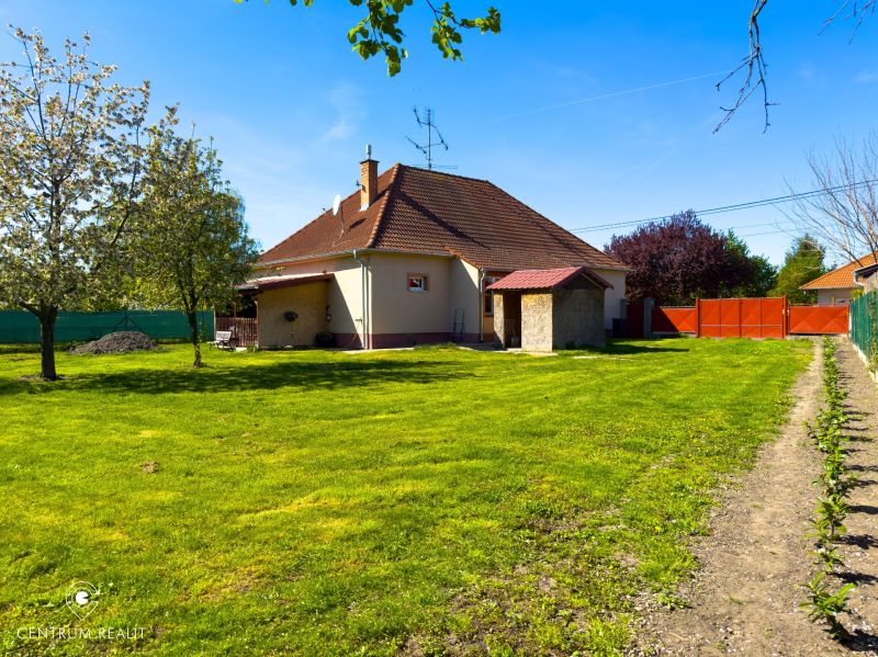 A family house in Orechová Potôň with a large garden, surrounded by greenery and trees.