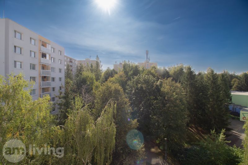 Sunset over the housing estate in Dubnica nad Váhom, Pod Hájom street, surrounded by greenery.