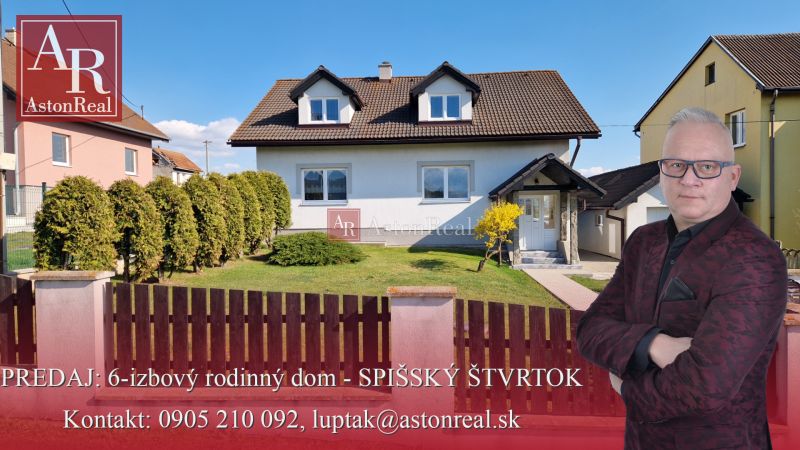 A family house in Spišský Štvrtok with a garage, garden, and landscaped exterior.