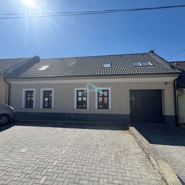 A family house on Petőfi Street in Šahy with a dark roof and three windows.