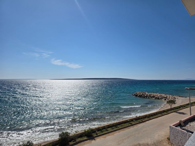 View of the coast in Mandre with the sea and clear sky.