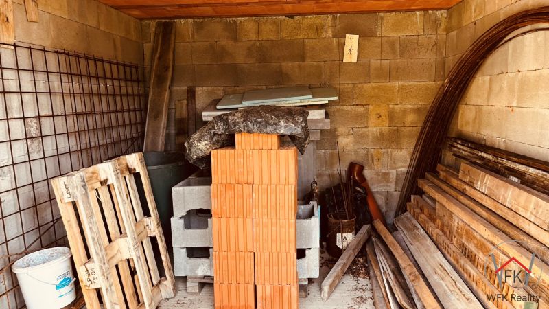 Warehouse with bricks, pallets, and construction materials at the Cottage in Nova Kelca, Recreational Area.