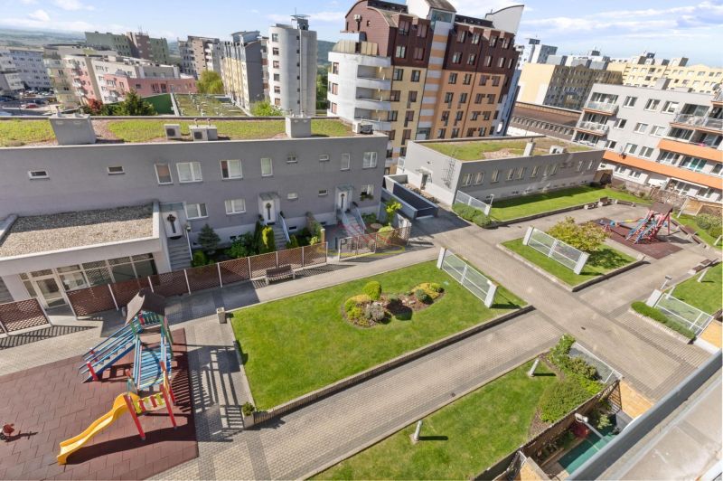 Playground and green areas near the apartment building on Majerníkova Street, Karlova Ves.