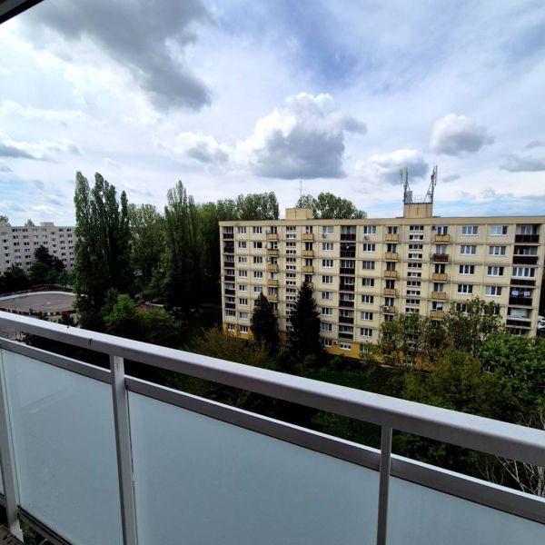 The view from the balcony on Čmelíková Street in Bratislava - Ružinov, surrounded by greenery.
