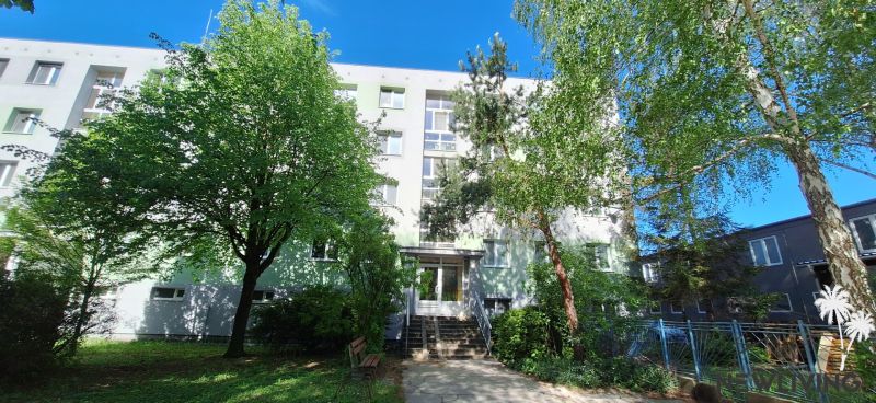An apartment building surrounded by trees on Vrbovská Street in Piešťany.