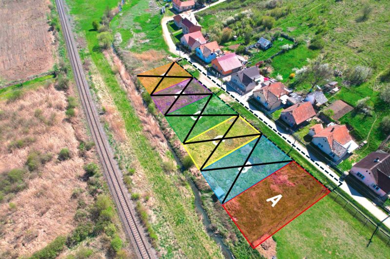 Aerial view of divided residential plots in Hodejov near the railway.