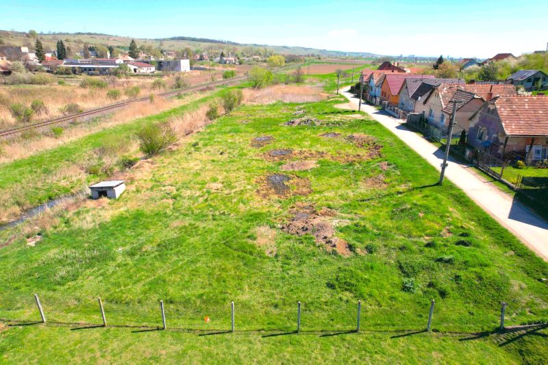A plot for residential use in Hodejov near the railway track, next to a residential area of family houses.