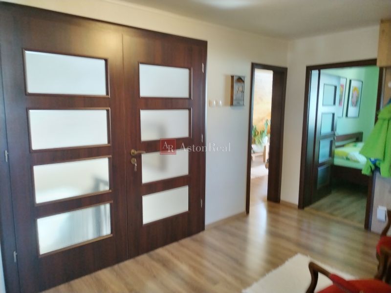 Interior of a family house with solid doors and a wooden decor floor.