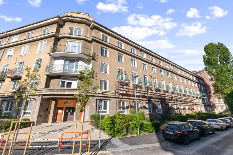 Building on Tabakova Street in Bratislava, Old Town with parked cars.