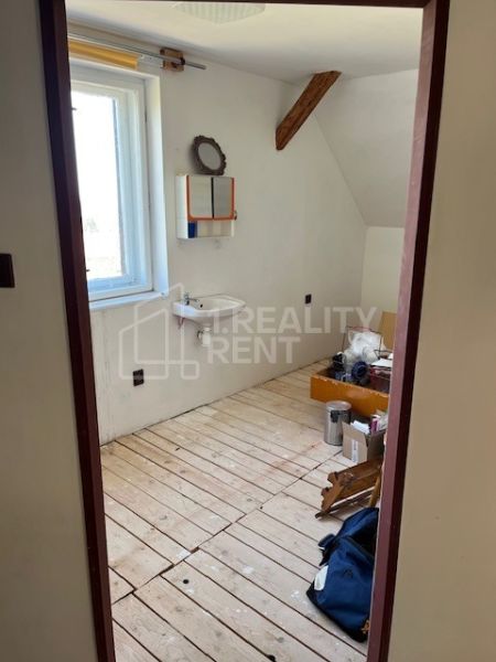 Interior of a family house with two sinks and wooden floor decor.