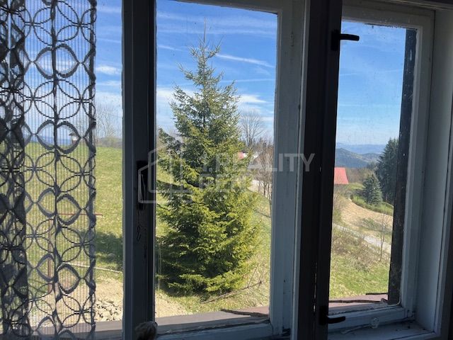 The view from the family house in Korňa with beautiful nature and a clear sky.