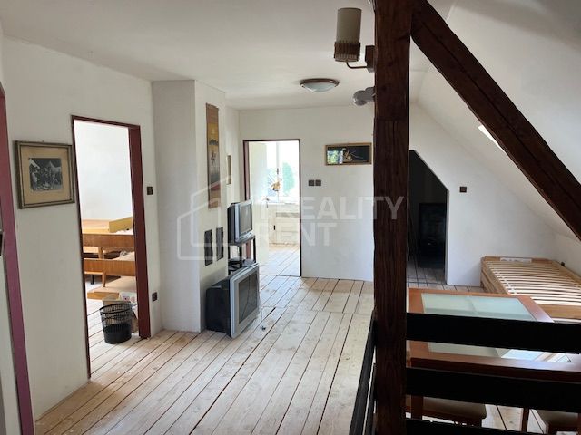 Interior of a family house with a wooden decor floor and a staircase.