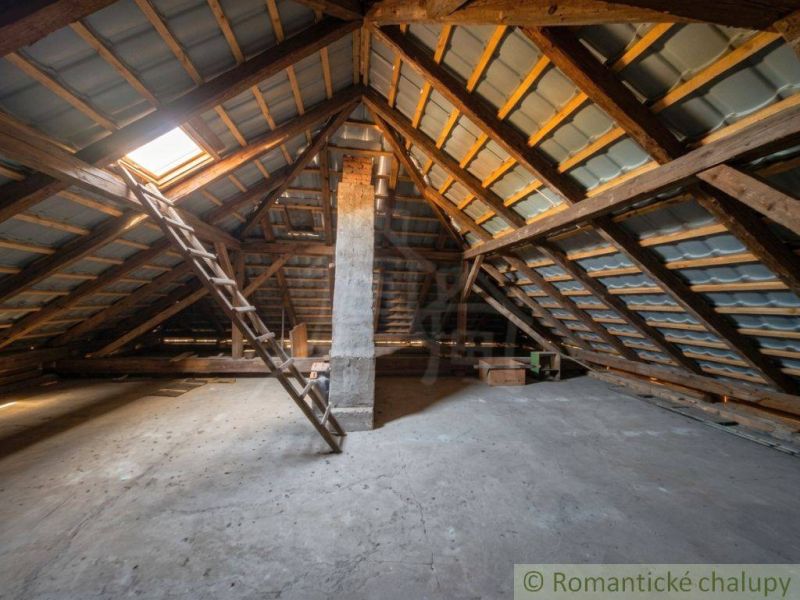 Ceiling with wooden beams and stairs, Family house Kriváň.