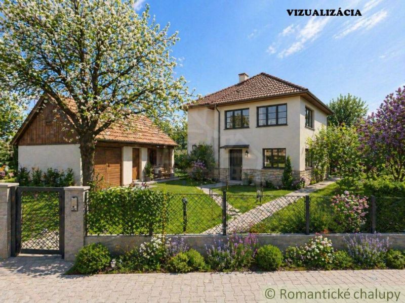 A family house in Kriváň surrounded by a garden with blooming trees and shrubs.