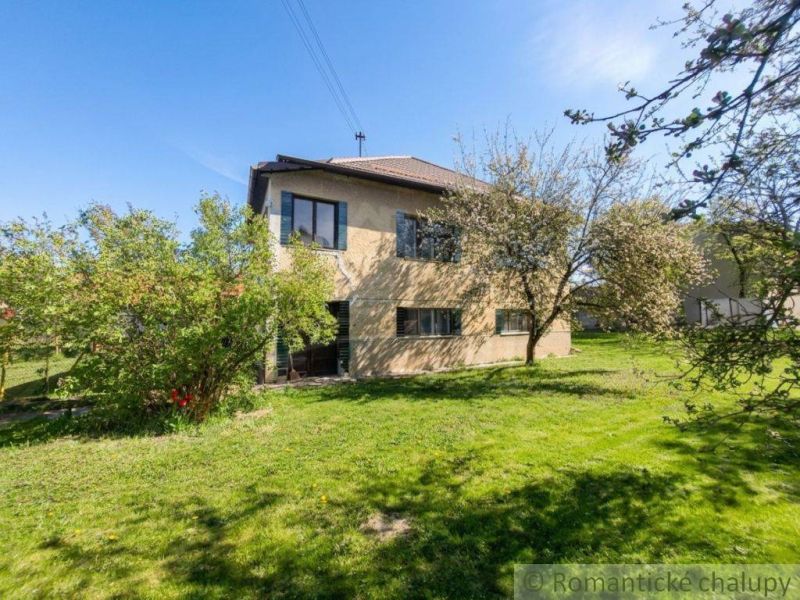 A family house in Kriváň surrounded by greenery and fruit trees in a spacious garden.