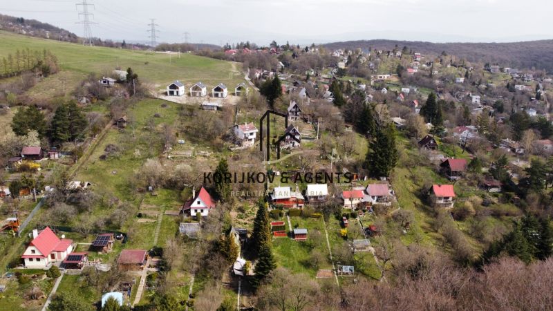 A view of cottages in Košice - Sever district on Kavečianska Road with extensive gardens.