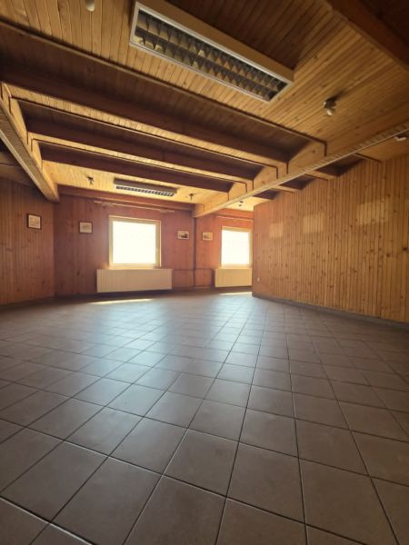 A room in Gastro premises with ceramic tiles and wooden walls and ceiling.
