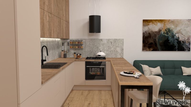 A kitchen in a 2-room apartment with a kitchen unit and a floor with a wooden decor.
