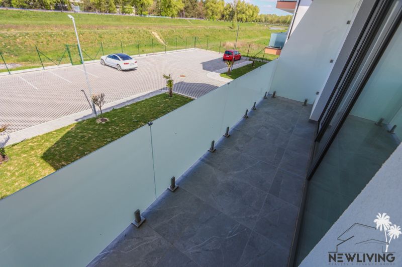 Balcony at a 2-room apartment with a view of the parking lot and greenery on Moravanska Street, Banka.