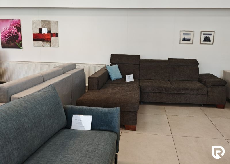 The commercial spaces display sofas and art paintings on the wall.