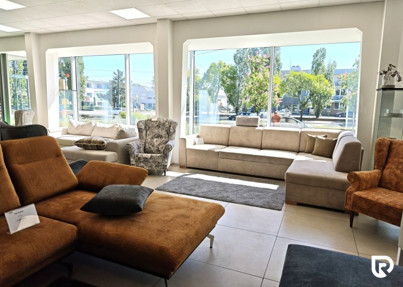 Bright commercial spaces with modern furniture and large windows.