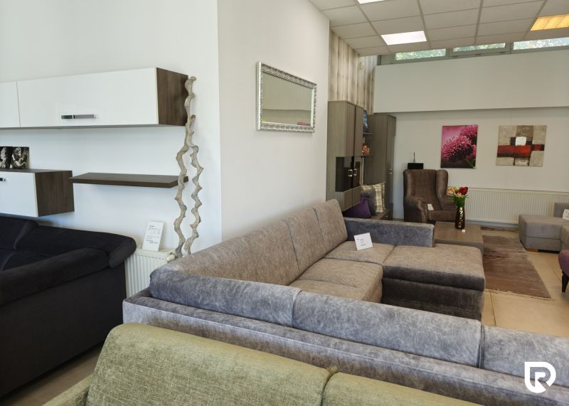 Commercial spaces with sofas, couches, and decorative elements, recessed lighting.