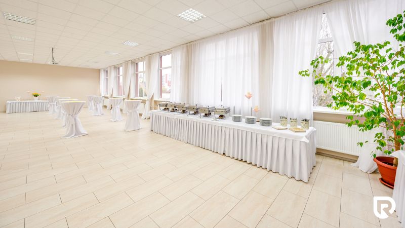 Spacious commercial spaces with large windows and wooden decor flooring.