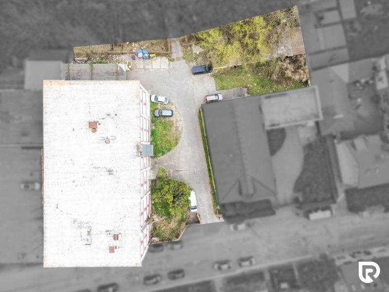 A top-down view of a building and parking lot on Ján Zigmundík Street, Vrbové.