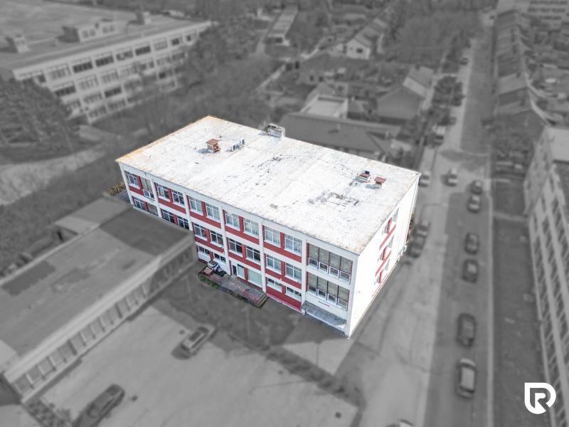 A building on Jána Zigmundíka Street in the town of Vrbové with commercial spaces.