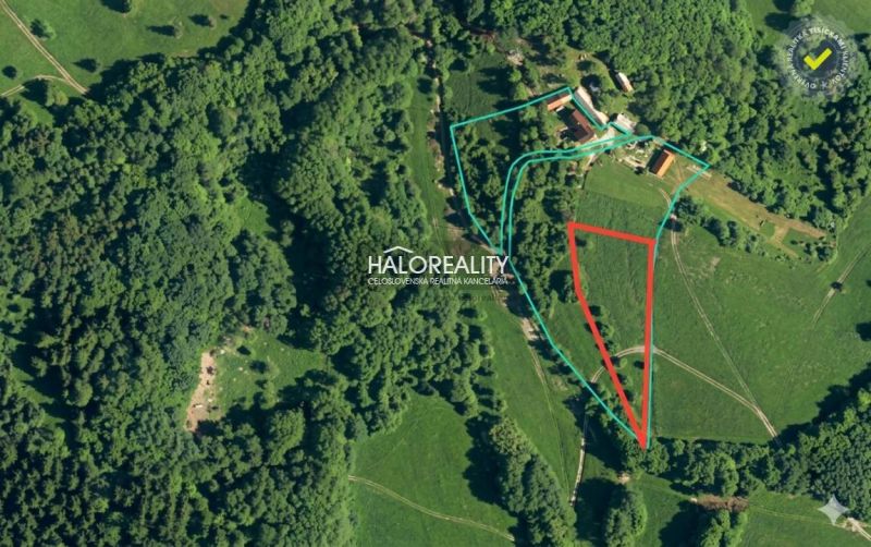 Aerial view of recreational land surrounded by forests in Horné Hámre.