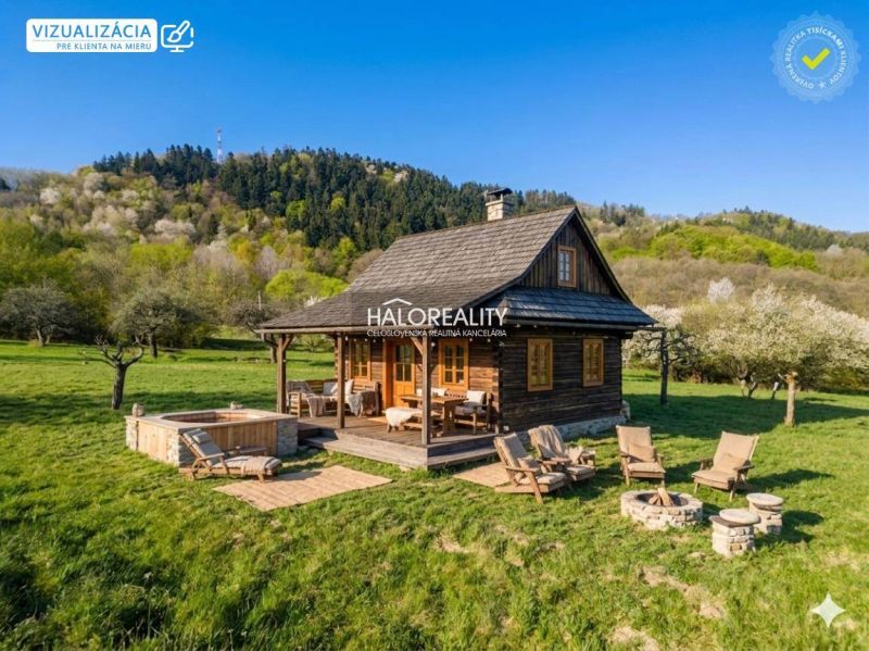 Recreational land in Horné Hámre with a wooden cabin, fireplace, and outdoor seating in nature.