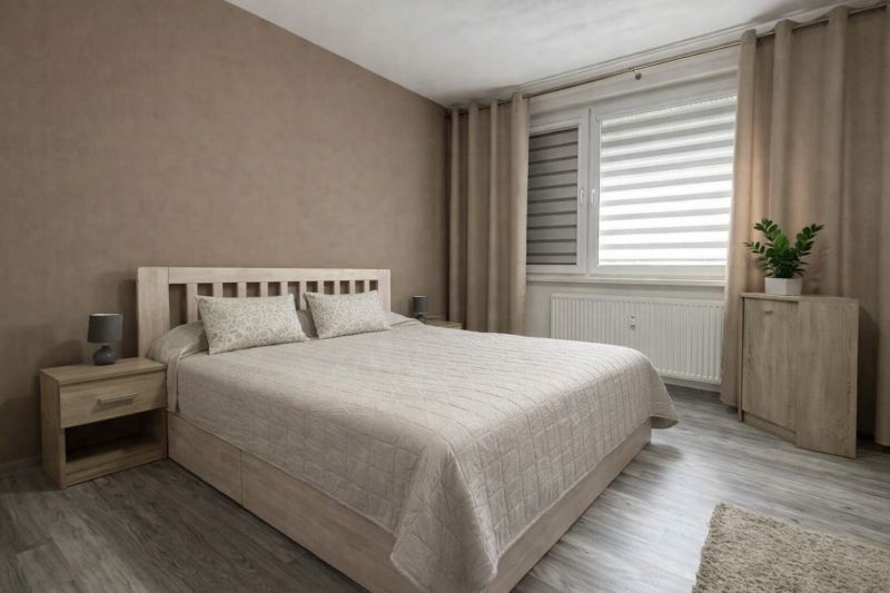 A bedroom with a bed, nightstands, and a floor with a wooden decor in a 4-room apartment.