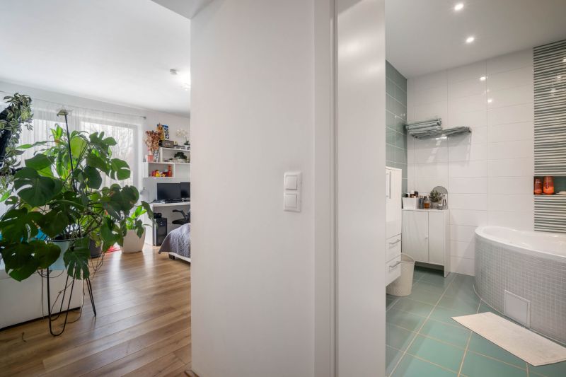 Interior of a family house with a wooden decor floor and a modern bathroom.