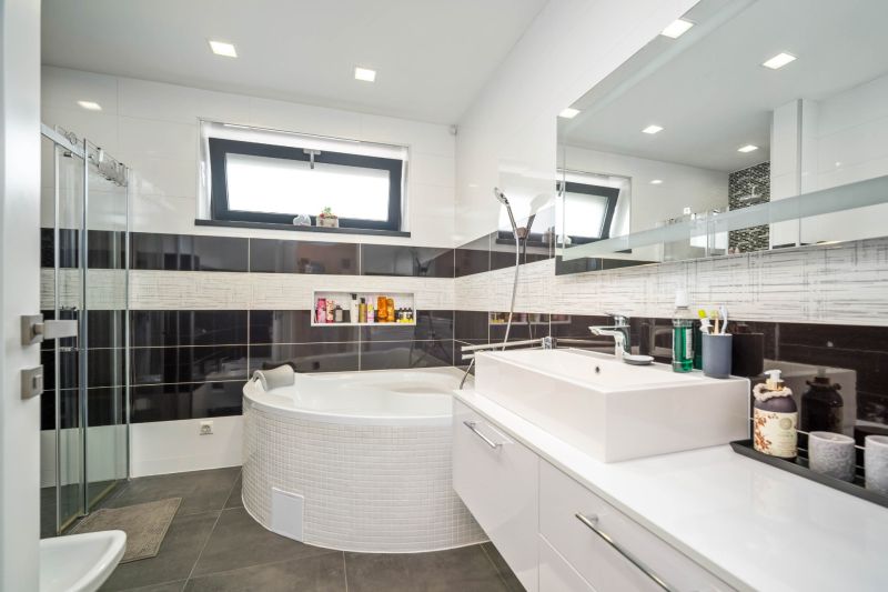 A bathroom in a family house with a corner bathtub and a large sink.