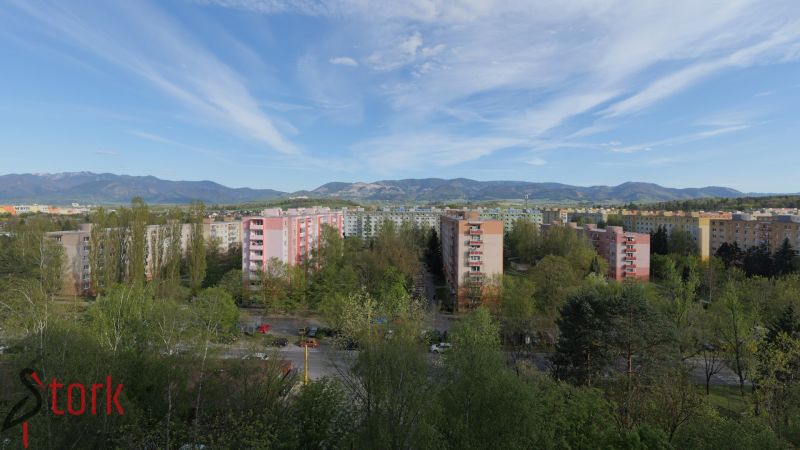 A view of the housing estate on Berlínska Street in Žilina with forests and mountains in the background.