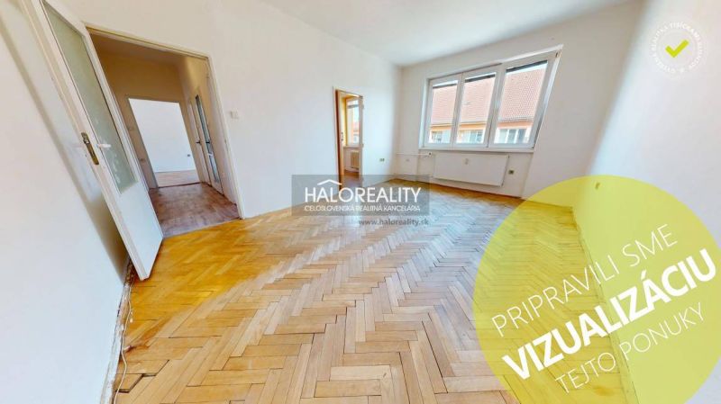Bright living room with wood-patterned flooring in a two-room apartment.