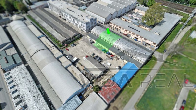 Aerial view of warehouses and halls on Coburgova Street in Trnava with a parking lot.