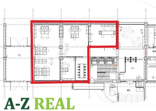 Floor plan of offices with a meeting room and separate workspaces.