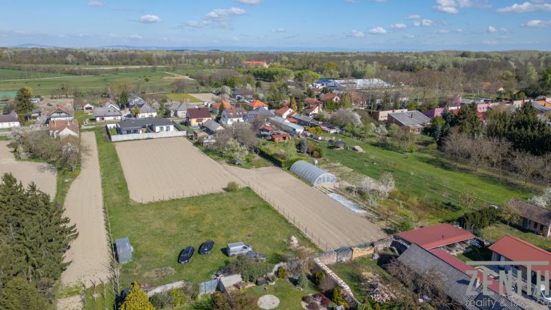 A view of the residential district and gardens in Dunakiliti with plots for living.