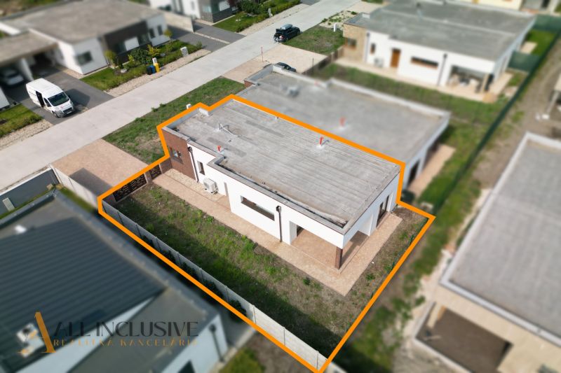 A family house in Dunajský Klátov with a marked plot and paved areas in the garden.