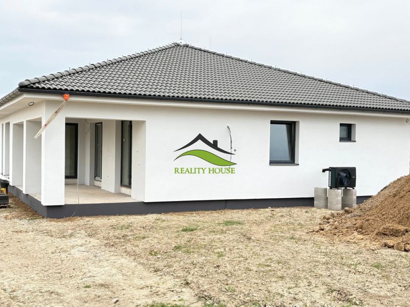A family house on Hlavná Street in Michalovce with a sloped roof and a terrace.