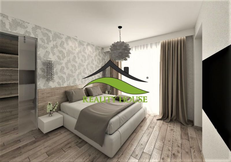A bedroom in a family house with wooden flooring and patterned wallpaper.