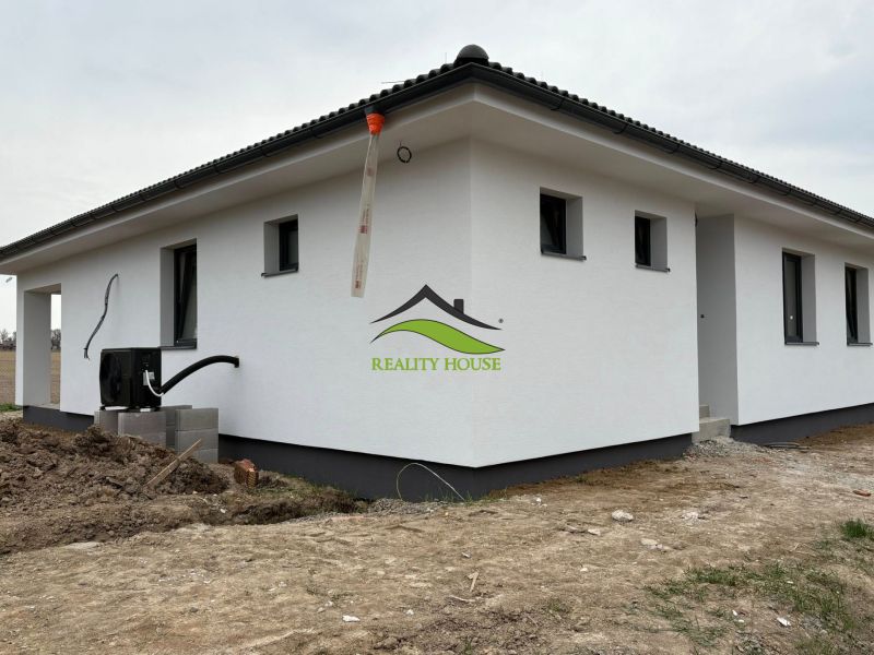 A family house on Hlavná Street in Michalovce with a white facade and a sloped roof.