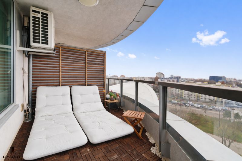 A balcony with comfortable loungers, a view of Bratislava from Bajkalská, ideal for a 3-room apartment.