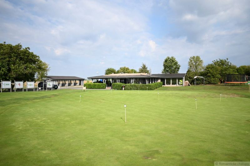 A building with a large green lawn in the Palárikovo area, Residential plots.