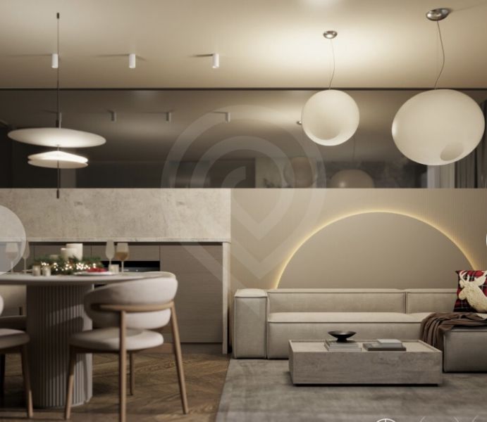 Interior of a holiday apartment with a wooden decor floor, a comfortable sofa, and a dining table.