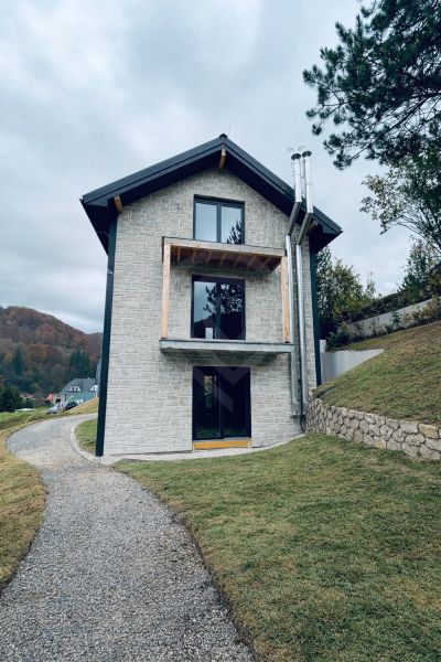 Stone recreational apartment in Mýto pod Ďumbierom surrounded by greenery and nature.