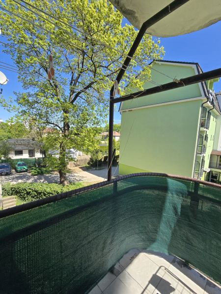 The balcony in Trenčianska Teplá on Cukrovarská Street offers a view of the green building.